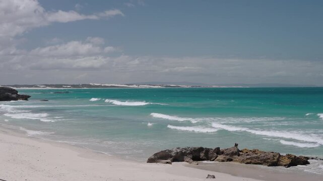4k 60p footage of stunning golden sands meeting turquoise waters along Arniston&rsquo;s beautiful Overberg coastline, Western Cape, South Africa. Iconic, remote beach serenity.