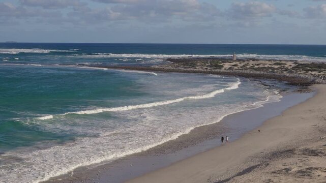 4k 60p footage of dramatic coastal view to Struis Point (Struispunt) and Saxon Reef from rugged sea cliffs near Waenhuiskrans Cave, Arniston. Turquoise Overberg waters, Western Cape, South Africa.
