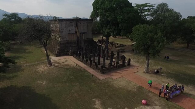 Aerial view of Wat Si Chum temple with the iconic giant seated Buddha statue in Sukhothai Historical Park, Thailand.