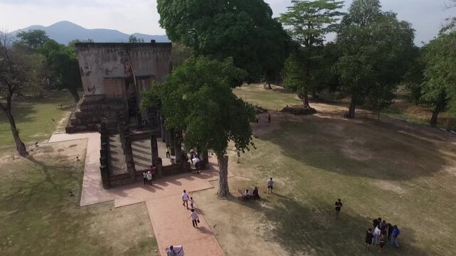Aerial view of Wat Si Chum temple with the iconic giant seated Buddha statue in Sukhothai Historical Park, Thailand.