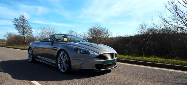 2011 Aston Martin DBS Volante, Luxury Car. car driving on road
