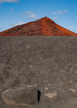 Lanzarote, Canary Islands: breathtaking desert landscape and red mountain in Timanfaya National Park (Parque Nacional de Timanfaya), famous geological park entirely made up of volcanic soi