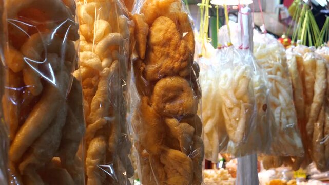 Dried fish maw or dried swim bladder. People shop for food for Lunar New Year. The food preparation is used for offering to ancestors, bringing fortune, good luck, and prosperity.