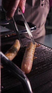 Juicy sausages grilled on the grill.