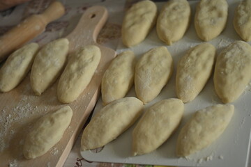 Fototapeta premium Homemade potato pies frying in pan traditional homemade food cooking process