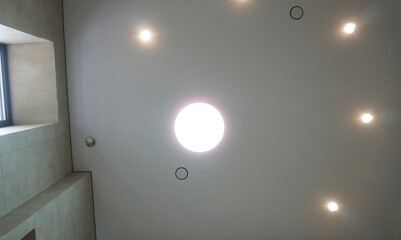  Large circular central lamp with recessed ceiling lights