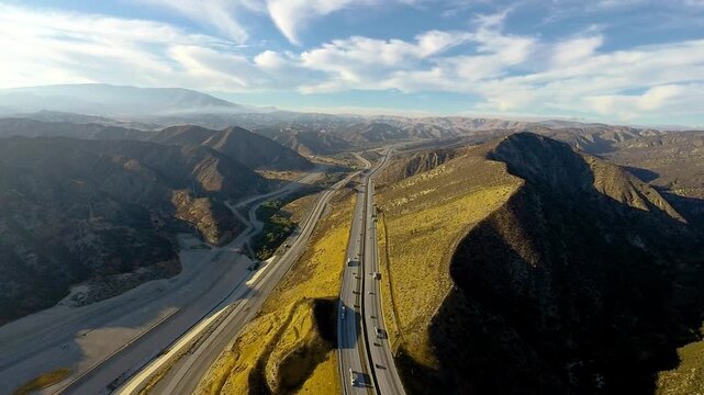 Flyover of Interstate 5, one of the nation's busiest and most important highways, as it winds its way across cuts and fills and through the Southern California mountains north of Pyramid Lake.