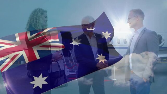 Center man stepping to woman offering hand, business meeting at jet with AUS flag overlay waving