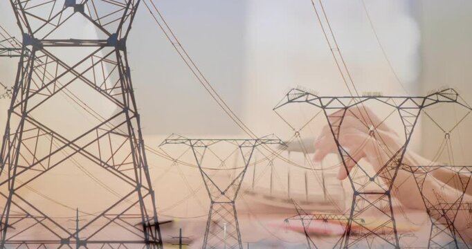 Admin starting typing on keyboard while power towers overlay, composing energy report
