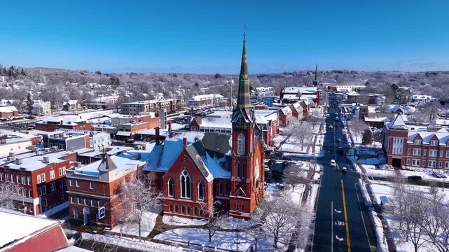 First Congregational Church aerial view in winter with snow at 2 E Central Street in historic town center of Natick, Massachusetts, USA.
