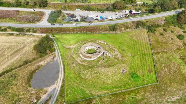 Cinematic Aerial Drone View of Carn Liath Broch, Iron Age Stone Tower in the Scottish Highlands, Ancient Archaeological Site near Sutherland Coast, Scotland, UK