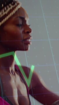 Vertical video: Reaching woman in pink bra gripping cardio handles at gym training with metric line