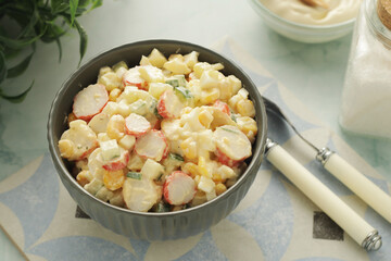 A bowl with traditional crab salad	