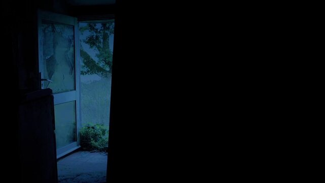 Broken Glass Door In Abandoned Building In The Dark