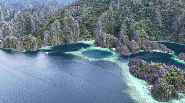 Cinematic drone video of tropical islands of Coron in the Philippines,  with azure blue water and lime stone rock formations