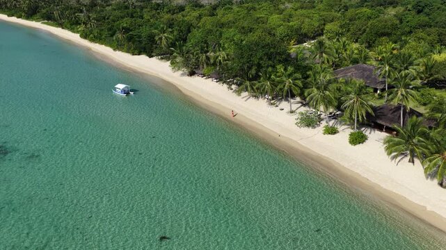 Cinematic drone video of tropical island with perfect sand beach in the Philippines  with azure blue water and beach
