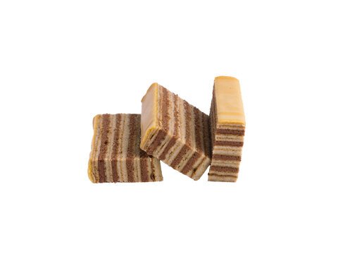 Three slices of indonesian layer cake lapis legit or spekkoek arranged together isolated on transparent background, traditional sweet dessert.
