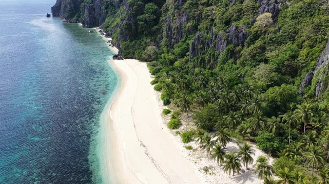 Cinematic drone video of tropical island in the Philippines  with azure blue water and beach