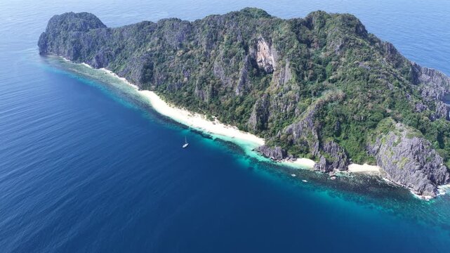 Cinematic drone video of tropical island in the Philippines  with azure blue water and beach