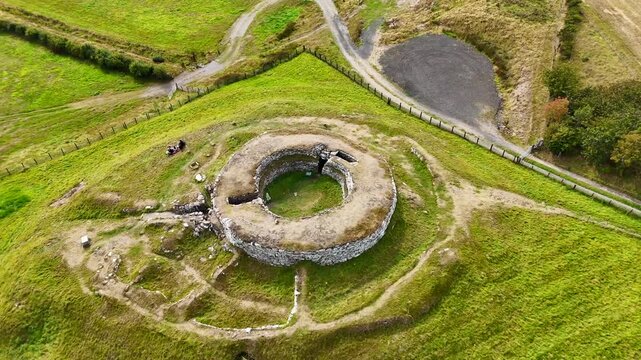 Aerial View of Carn Liath Broch, a Prehistoric Iron Age Stone Fortress in the Scottish Highlands, Ancient Archaeological Heritage Site in Sutherland, Scotland