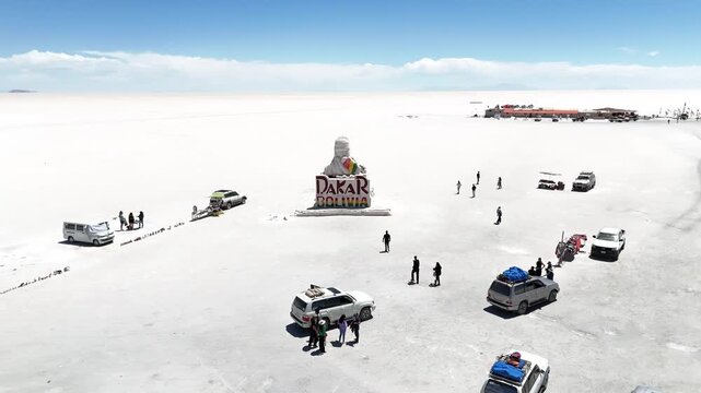 Salar de Uyuni. Endless white landscape and rider on the vast Bolivian salt flats.