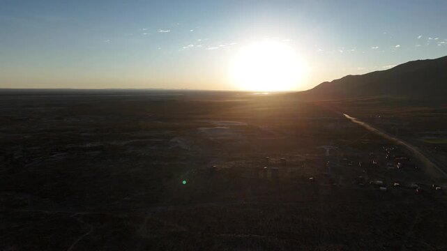 Dramatic sunset over the Altiplano in Huachacalla, Bolivia. Burning orange sky over the high plateau and rural landscape.