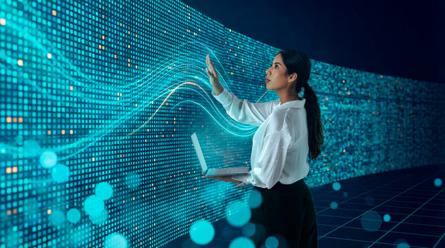 Latin woman interacting with digital data wall using laptop