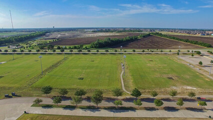 Naklejka premium Aerial Drone photo of McKinney Soccer Complex at Craig Ranch at sunset