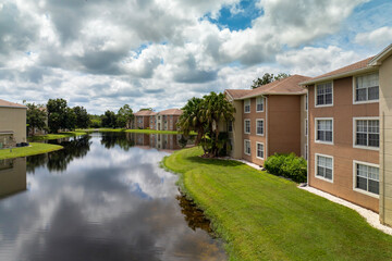 Densely built residential apartment houses near retention ponds in closed living clubs in south...