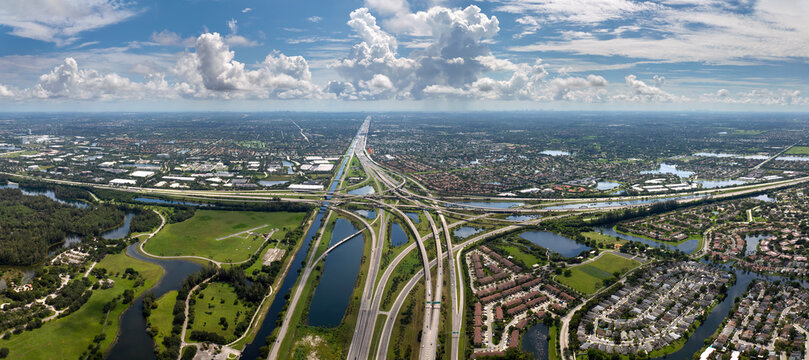 Elevated freeway intersection in American city of Miami, Florida with fast moving cars. USA transportation infrastructure concept