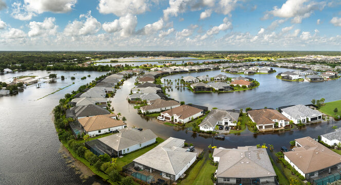 Flooded residential area with underwater houses from hurricane Debby rainfall water in Sarasota, Florida. Aftermath of natural disaster in southern USA