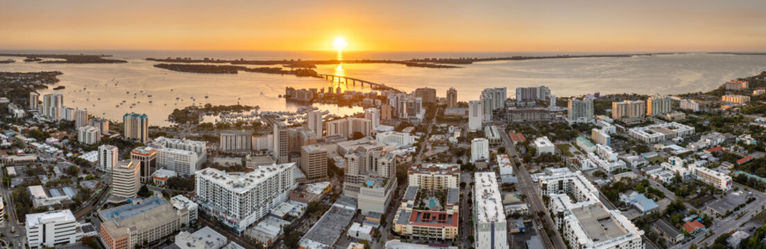 Sarasota, Florida city downtown at sunset with expensive bayfront high-rise buildings. Urban travel destination in the USA