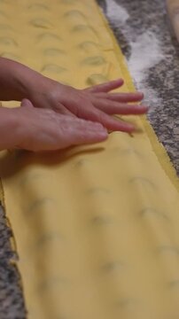 Hands Sculpting Italian Pasta With Flour, Skilled Chef Making Homemade Italian Pasta Using Fresh Ingredients, Preparing Traditional Italian Pasta Ravioli In Kitchen, Authentic Cooking Process
