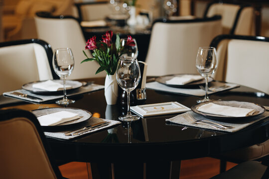 Elegant Table Setting with Glasses and Vase