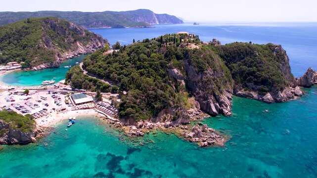 Paleokastritsa Corfu 4k drone of turquoise bays and rocky peninsulas in Greece. Scenic aerial view of Mediterranean crystal water and beaches. Ionian Islands cinematic travel scenery