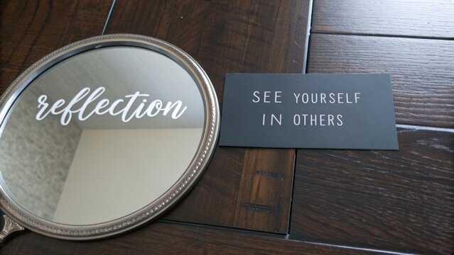 Mirror reflecting quote about seeing yourself in others
