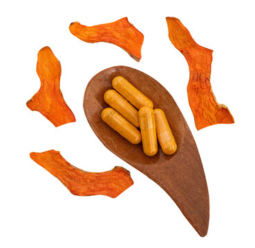 Turmeric or Curcuma longa dried slices and powder in capsules  isolated on transparent background.top view.