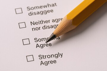 Survey Form with Pencil Pointing to Response Options for Agreement and Disagreement Evaluation