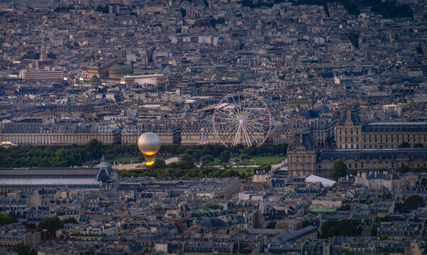 Aerial view of Tuileries Garden in Paris, France, with Paris 2024 Olympic golden balloon of the olympic flame and Tuileries Ferris wheel. The cauldron, debuted during the 2024 Summer Olympic Games