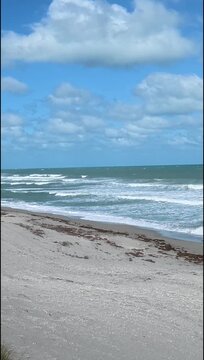 Vertical Atlantic Shore: Powerful Waves Breaking on Hobe Sound Beach, Florida