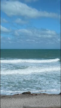 Vertical Atlantic Shore: Powerful Waves Breaking on Hobe Sound Beach, Florida