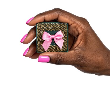 Hand holds a dark green tech item adorned with a pink bow, against a white background with bright pink fingernails