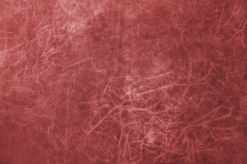Fototapeta premium Close up, macro of matte red genuine leather, leatherette surface with fine grain and soft fibrous texture. Smooth faux leather, upholstery material, abstract background, wallpaper, backdrop