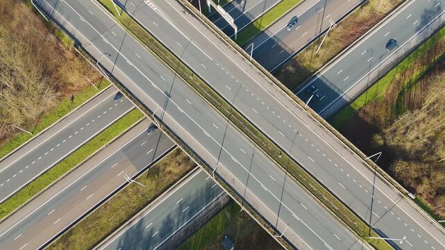 vertical motorway flyovers parallel lanes ghent vehicle traffic moving through layered highway infrastructure near aerial drone view road transport transportation junction interchange 