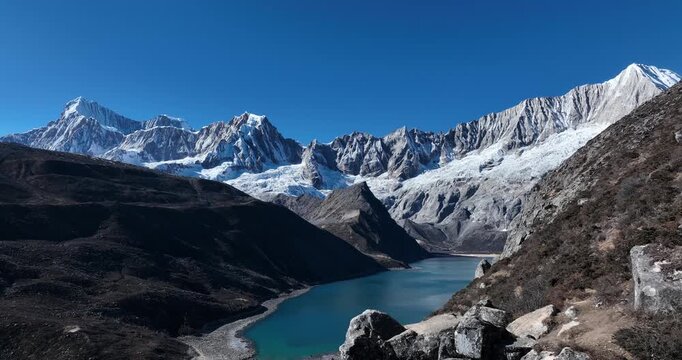 Backpacking woman hiking on high altitude mountain top