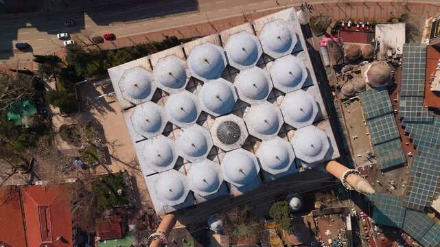 Top aerial drone view of the domes of the historic Grand Mosque (Ulu Camii) in Bursa, Turkey.