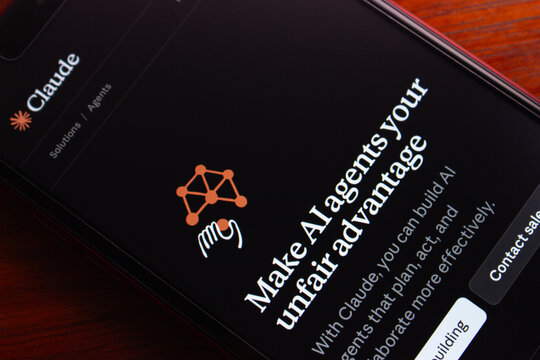 Quito, ECUADOR - Mar 9 2026 : Close-up of a smartphone screen displaying the Claude AI agents website. AI agents, tech, artificial intelligence tools, and digital productivity.