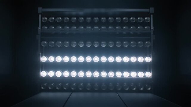 bright stage lights shining on dark background