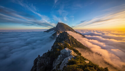 Fototapeta premium Sunrise mountain ridge above sea of clouds, golden light and dramatic sky