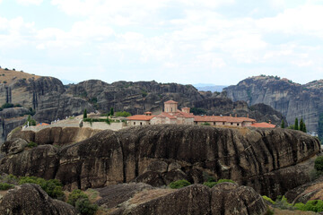 Fototapeta premium Great Meteoron Plateia Lithos August 2024 Ancient stone monastery on the Broad Rock in Meteora